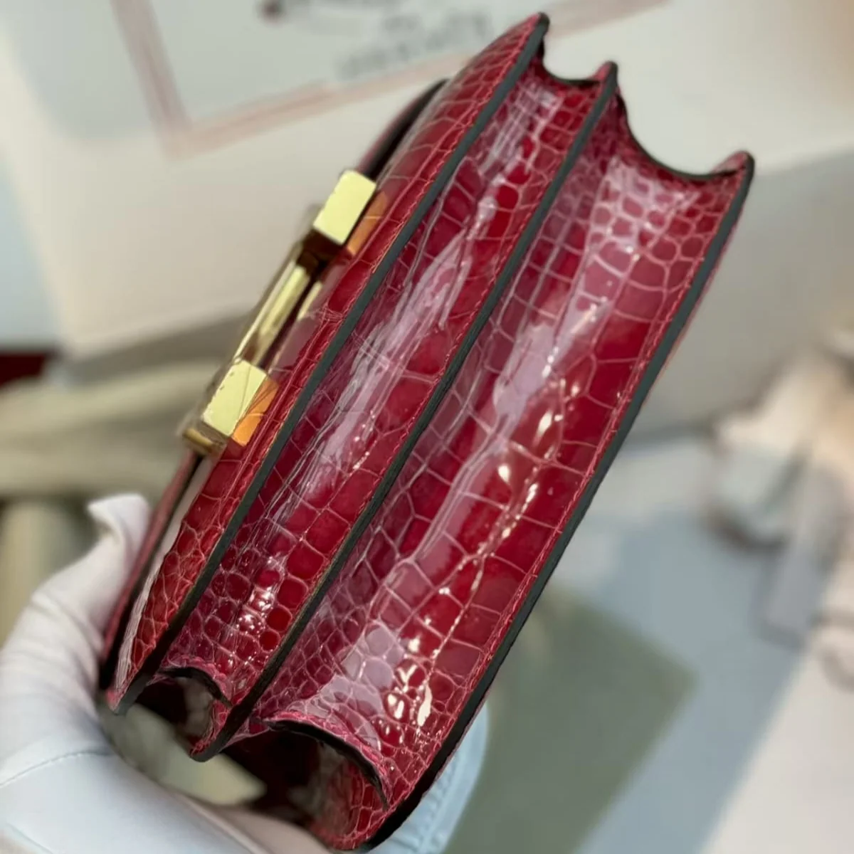 Hermès Constance 18 Red crocodile-embossed leather bottom view