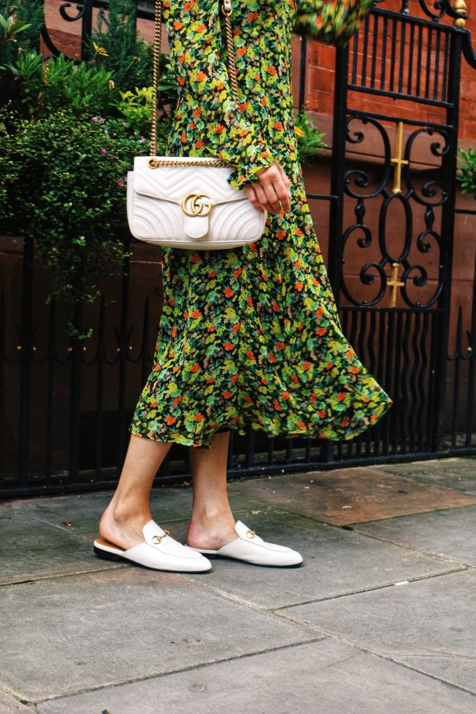 Flap Gucci Marmont bag worn over the shoulder