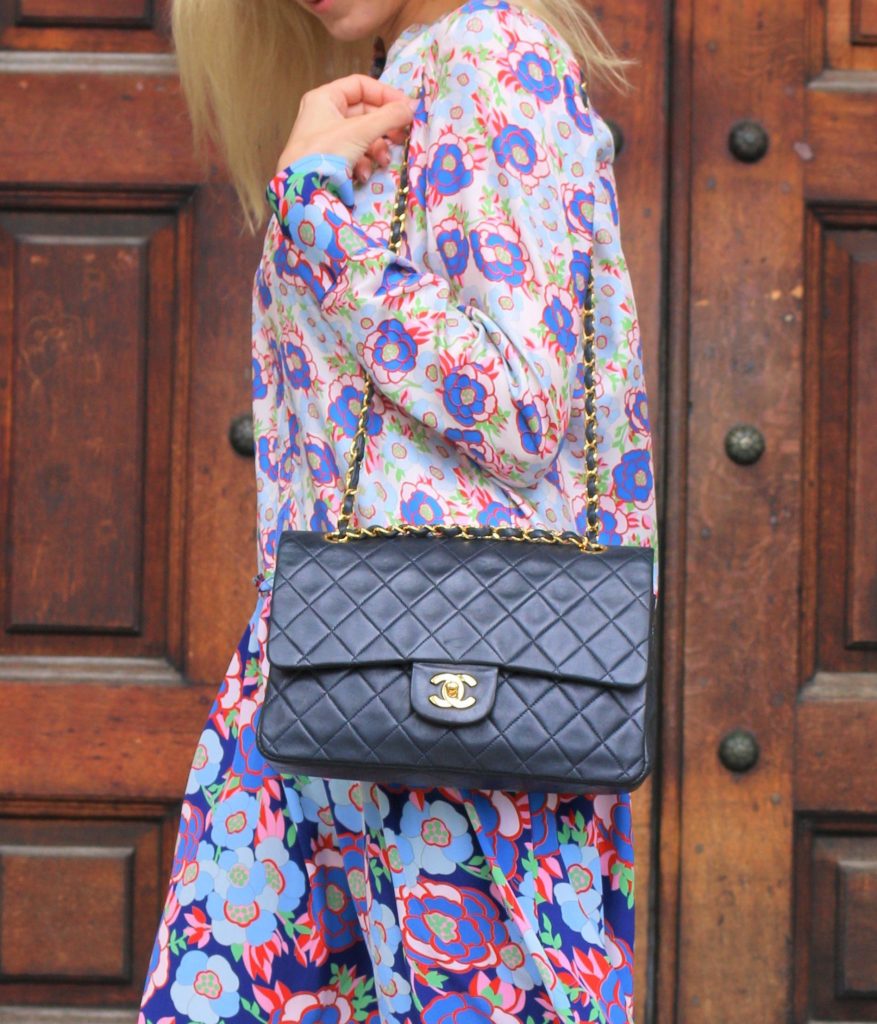 Restored vintage Chanel bag worn over the shoulder