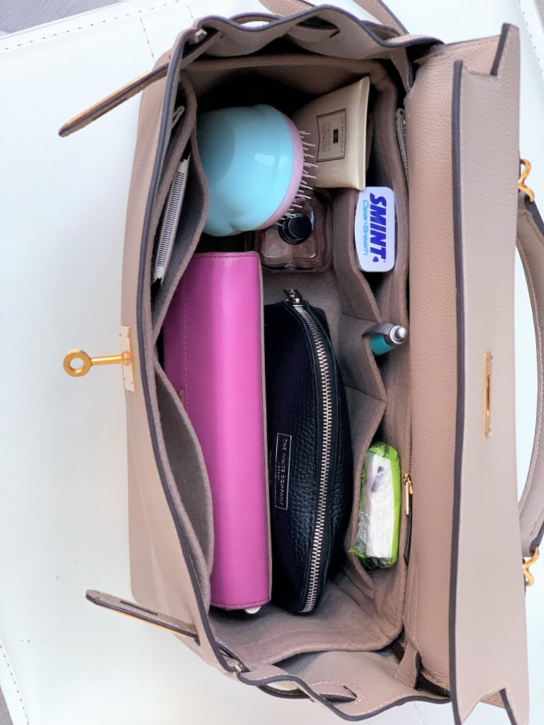 Interiors of Hermes Kelly 32 bag with inserted organiser