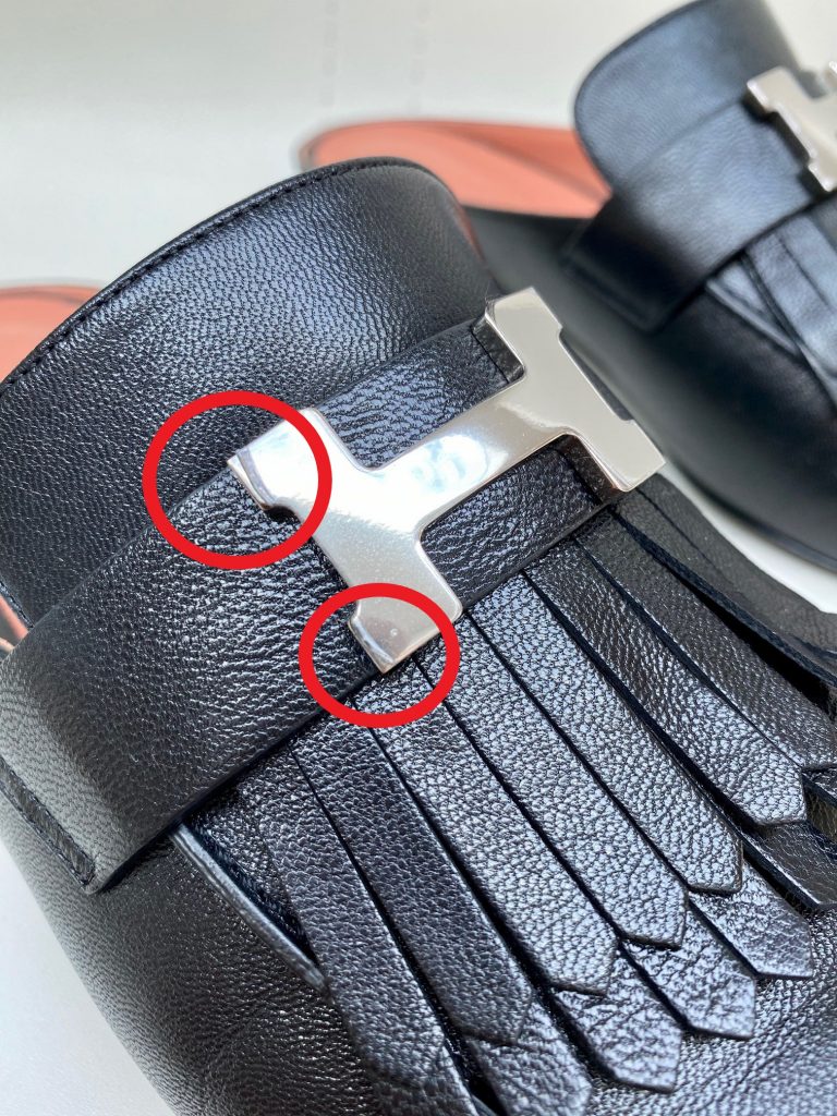 Plastic protectol on the hardware of Rivoli shoe