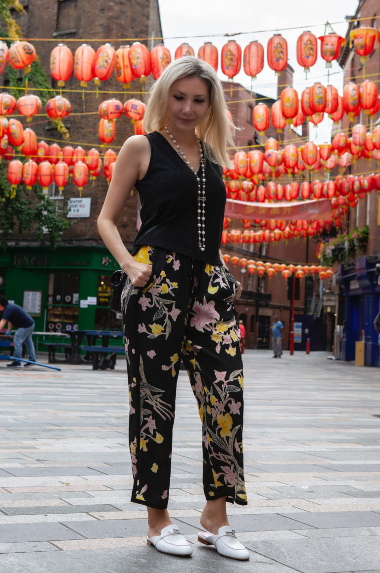 Full body photo showing the shoes with Chinatown background