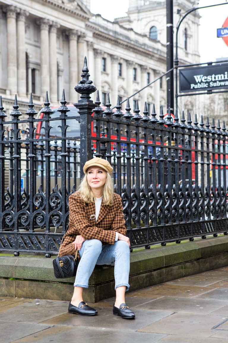 Black Gucci loafers photgraphed next to Westminster Station