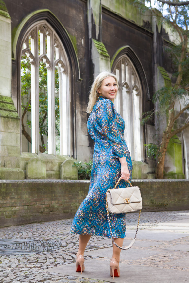 Chanel 19 bag photographed in a churchyard