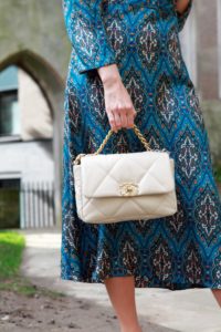Chanel 19 bag held by the top handle mod shot