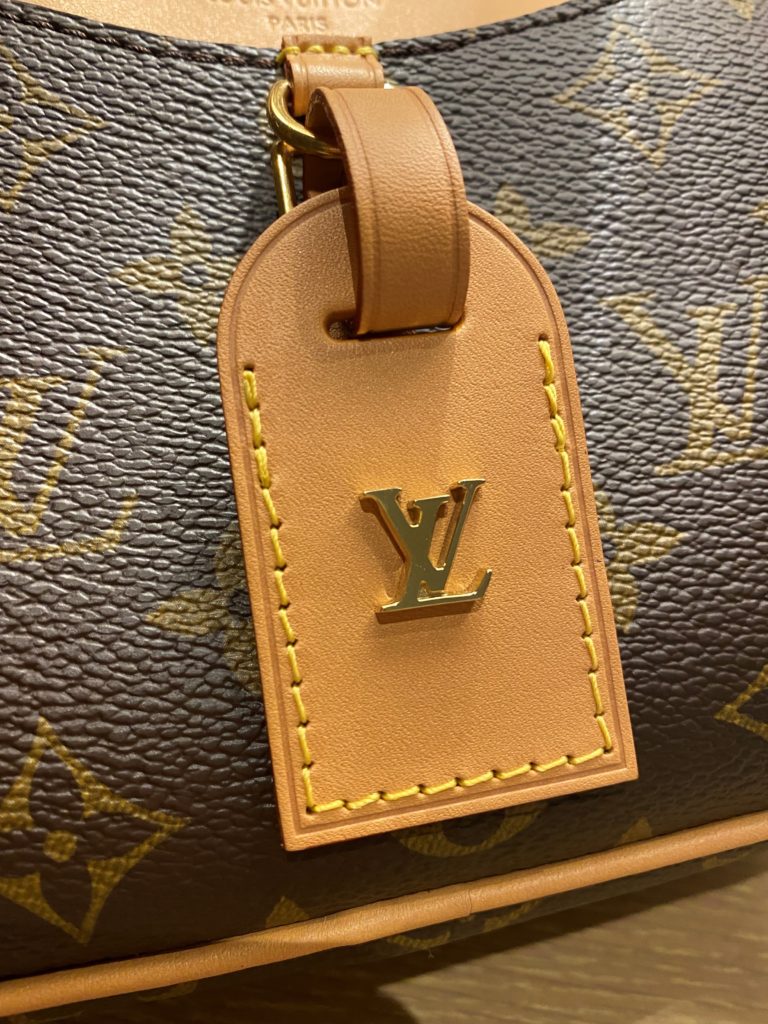 Close up on the tag of the LV Mini Deauville bag